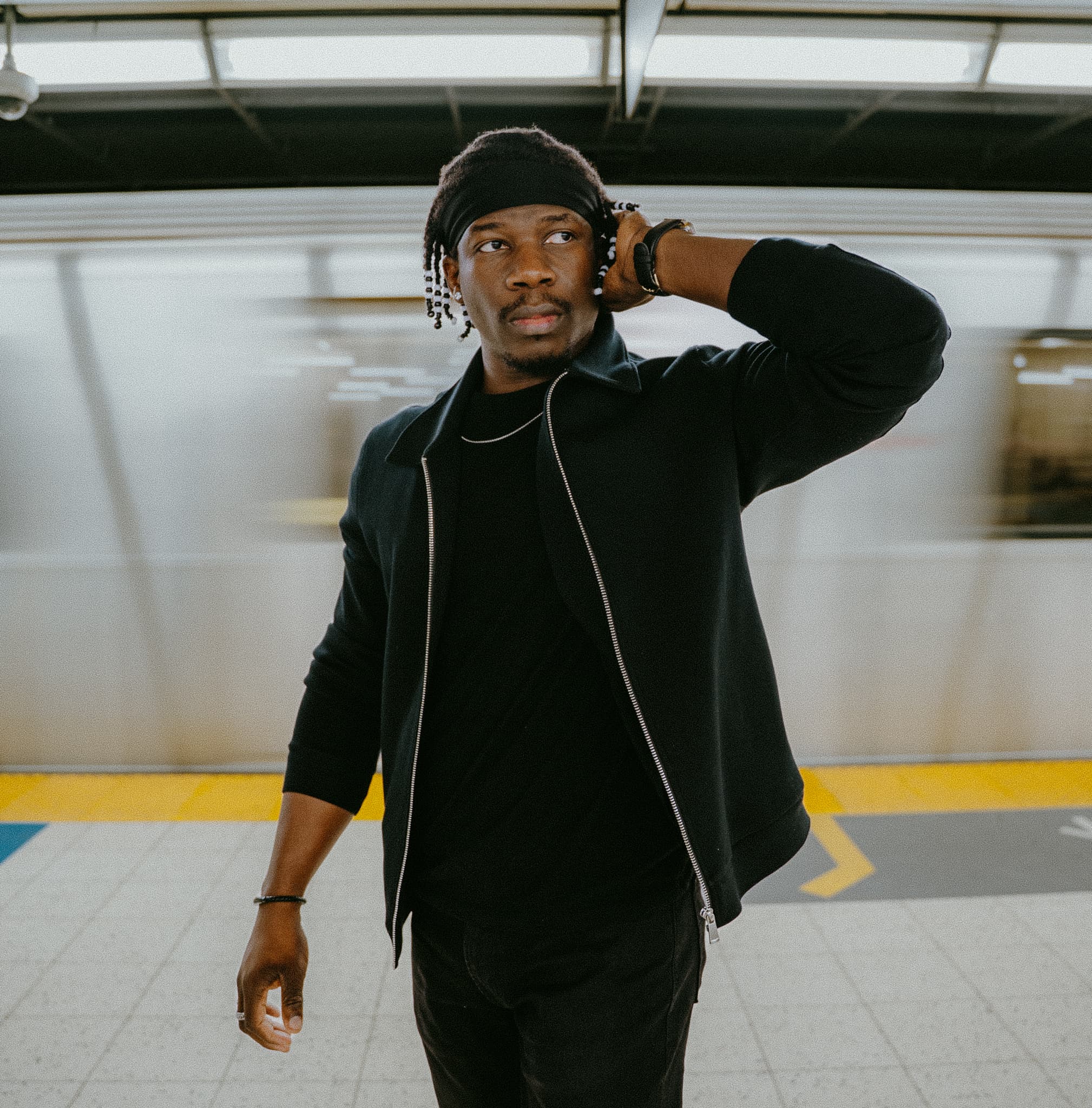 Man in subway with a motion blured background